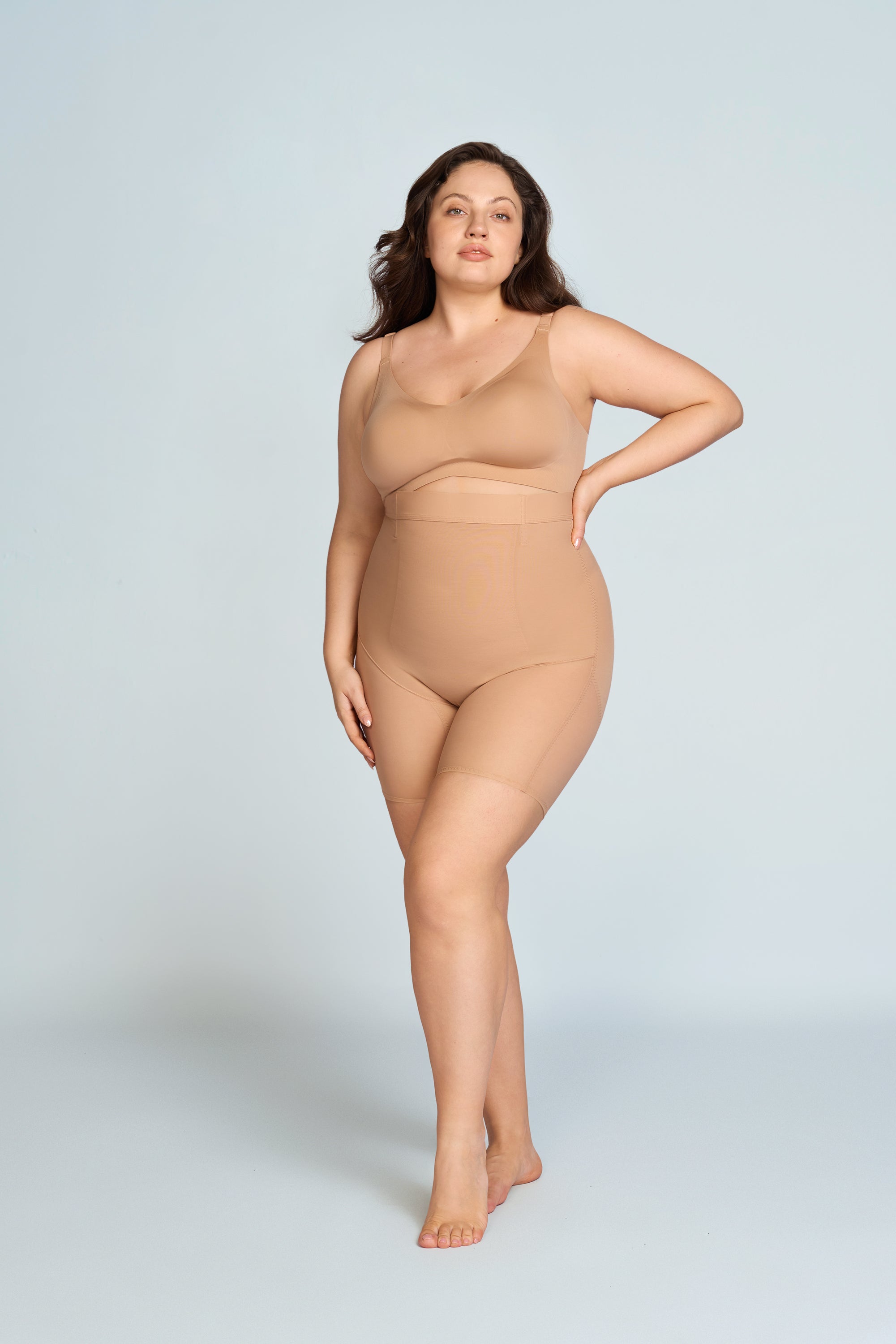 Woman wearing a nude wireless comfort full coverage bra. The brand is Baerely who supports wireless bras with support and lift.