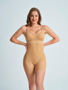 Woman wearing a nude shapewear control panties. The brand is Baerely who supports womens shapewear tummy control & women's shapewear control panties.