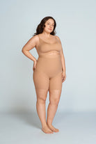 Woman wearing a nude wireless support bra. The brand is Baerely who supports full coverage bras for women wireless.