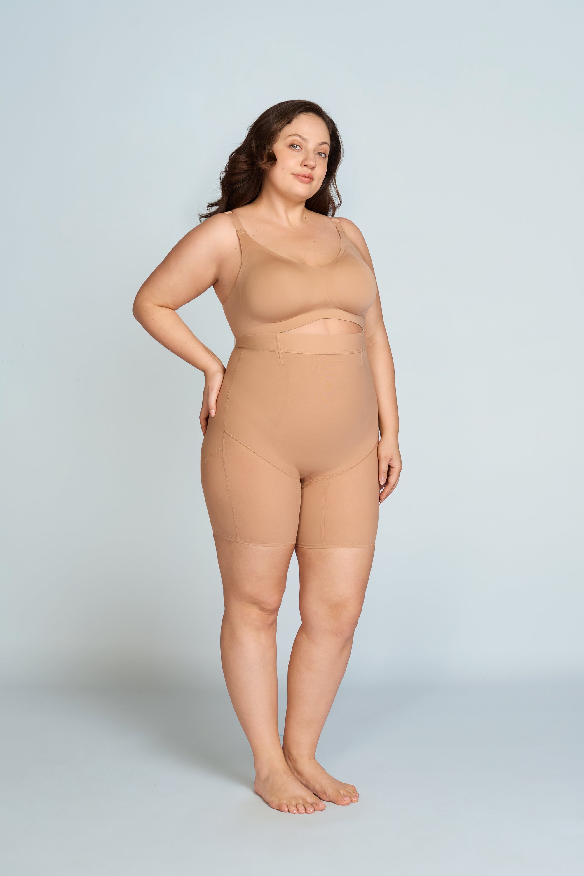 Woman wearing a nude wireless support bra. The brand is Baerely who supports full coverage bras for women wireless.