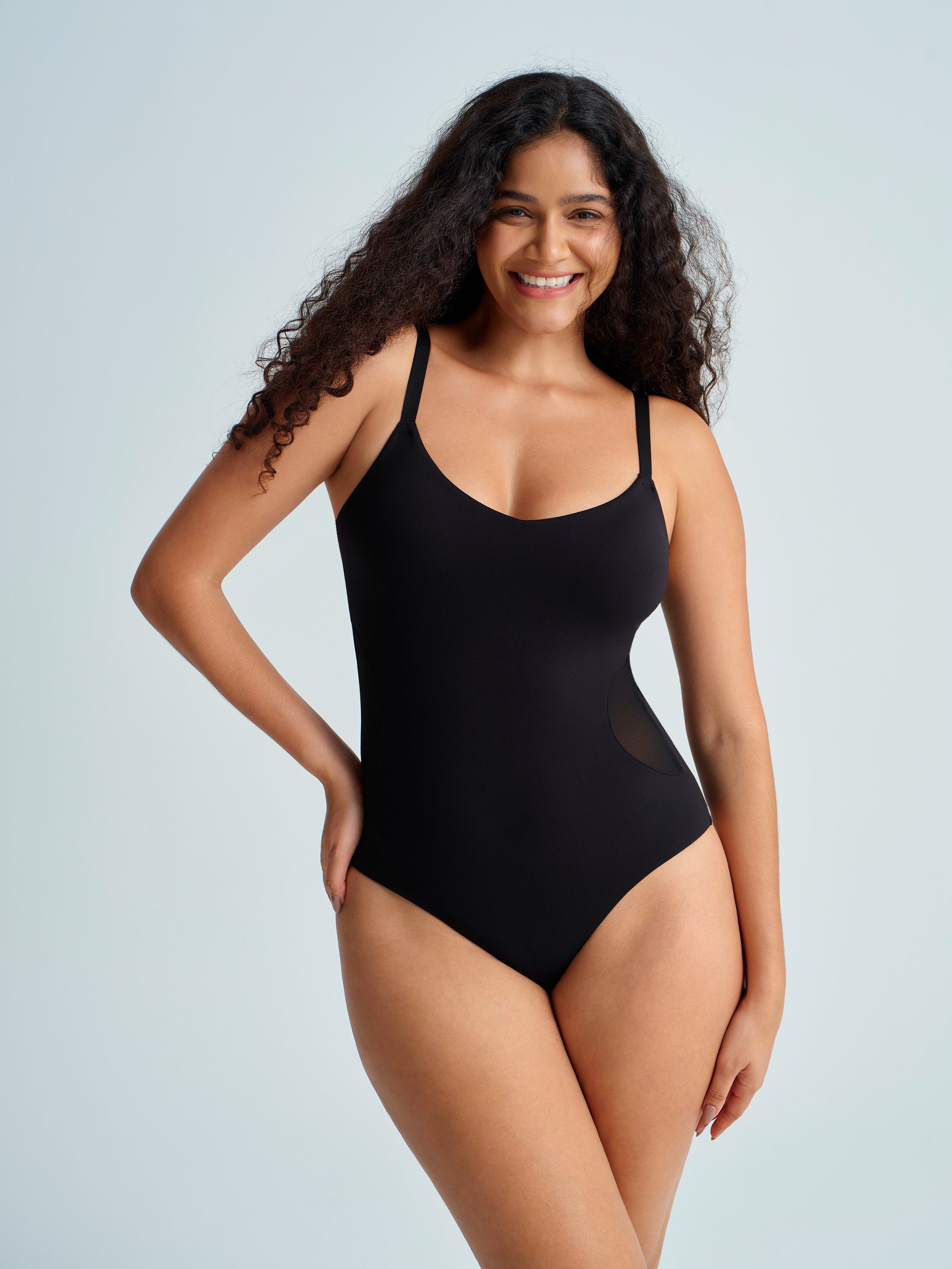 Woman wearing a black tummy control bodysuit. The brand is Baerely who supports shapewear bodysuit & tummy control bodysuit & shape wear bodysuit & body suit tummy control.