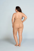 Woman wearing a nude wireless support bra. The brand is Baerely who supports women bras wireless full coverage.